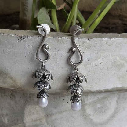 Naari Jewels Oxidized German Silver Peacock Floral 3-Layer Jhumka with Pearl Drops Earring